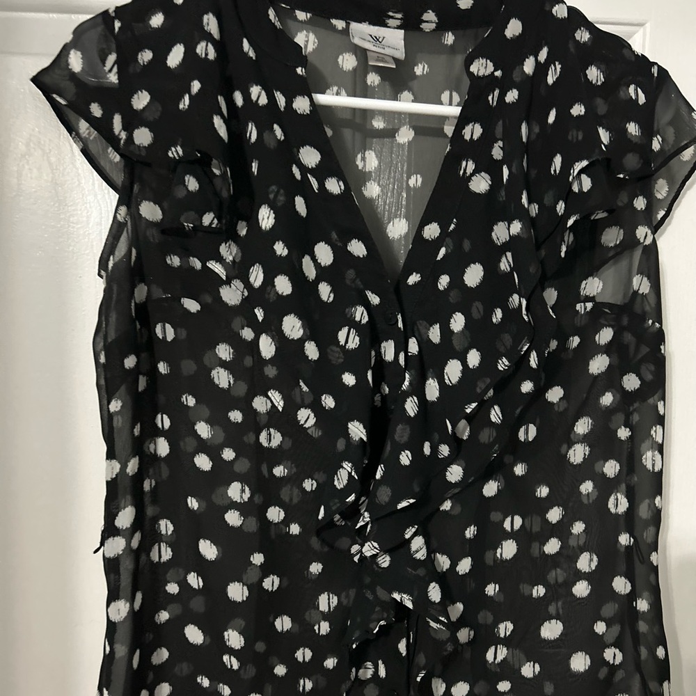 Women’s black and white sheer polka dot blouse.